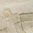 Fyffe Embossed Beige Wool Area Rug