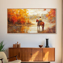 Cowboy sitting by campfire near a lake in the woods with autumn leaves, Framed Canvas Print, moody fall wall art, rustic western home decor