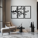 Minimalist black metal wall art featuring a three-panel tree branch silhouette design, perfect for modern and nature-inspired interiors.