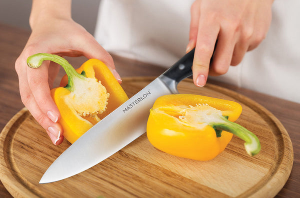 MASTERPAN Essential Chef’s Knife Bundle - 8" Chef’s Knife, 8" Slicer Knife & 7" Santoku Knife - Stainless Steel Blades with Protective Covers, installed in a room