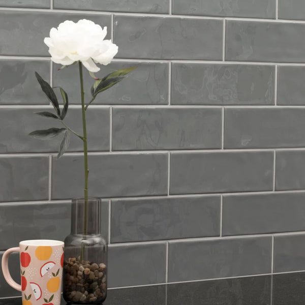 MSI Urbano Graphite Glossy Ceramic Subway Tile 4"x12", installed in a room