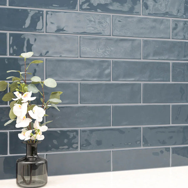MSI Urbano Navy Glossy Ceramic Subway Tile 4"x12", installed in a room