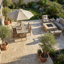 Outdoor patio with furniture, table, chairs, and a fire pit area. Meandros Walnut Travertine Pattern Pavers