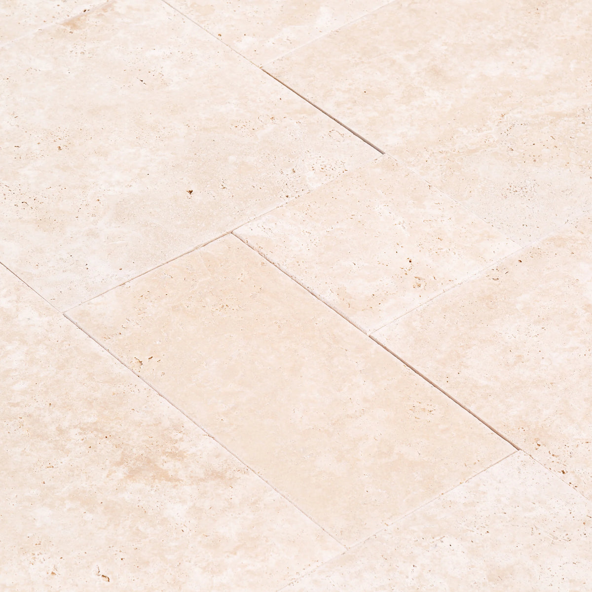Travertine Miletos Ivory Tumbled Pavers, close-up of the surface