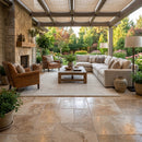 Outdoor patio with furniture and decorative elements. Mina Rustic Travertine Tumbled Pavers
