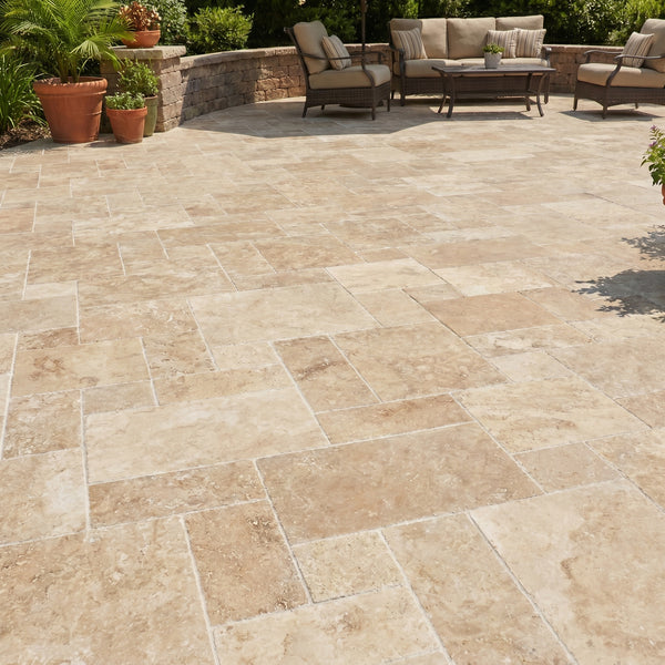 Outdoor patio with stone tiles, furniture, and plants