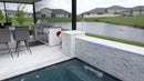 Outdoor kitchen with pool and residential area view. Turkish Carrara White Marble Sand-Blasted Pavers