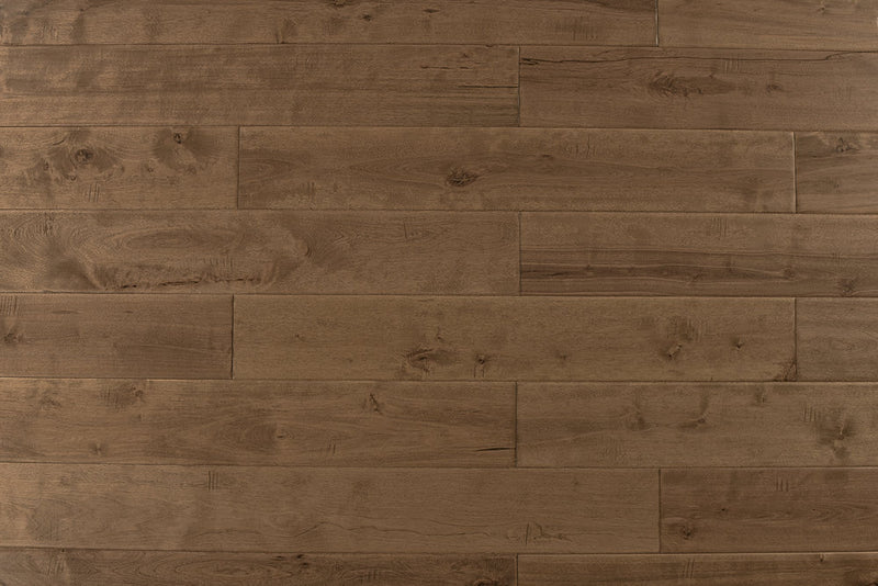 "High-quality Maple Distressed/Handscraped Solid Hardwood Flooring in a Natural Toast finish. Each plank measures 3/4 x 5 inches. SKU: TRPSH-MPNT. Enhance your space with its warm tones and exquisite texture."