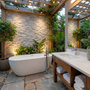 Outdoor bathroom with stone wall, bathtub, and vanity area. Palia White Dolomite 2"x4" Brick Split Face on 12" x 12" Mesh Mosaic Tile