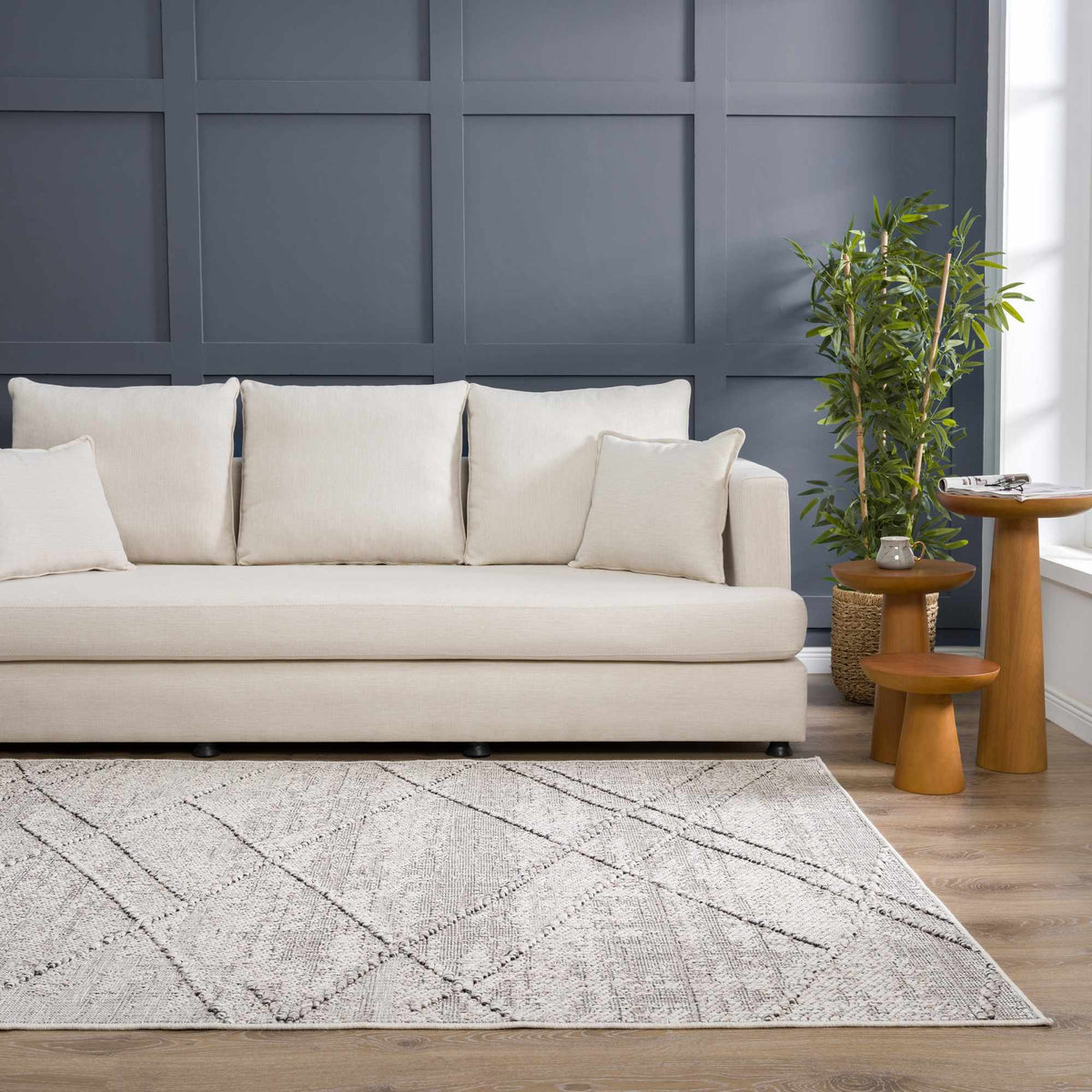 Baqer Bone & Taupe Area Rug, installed in a room