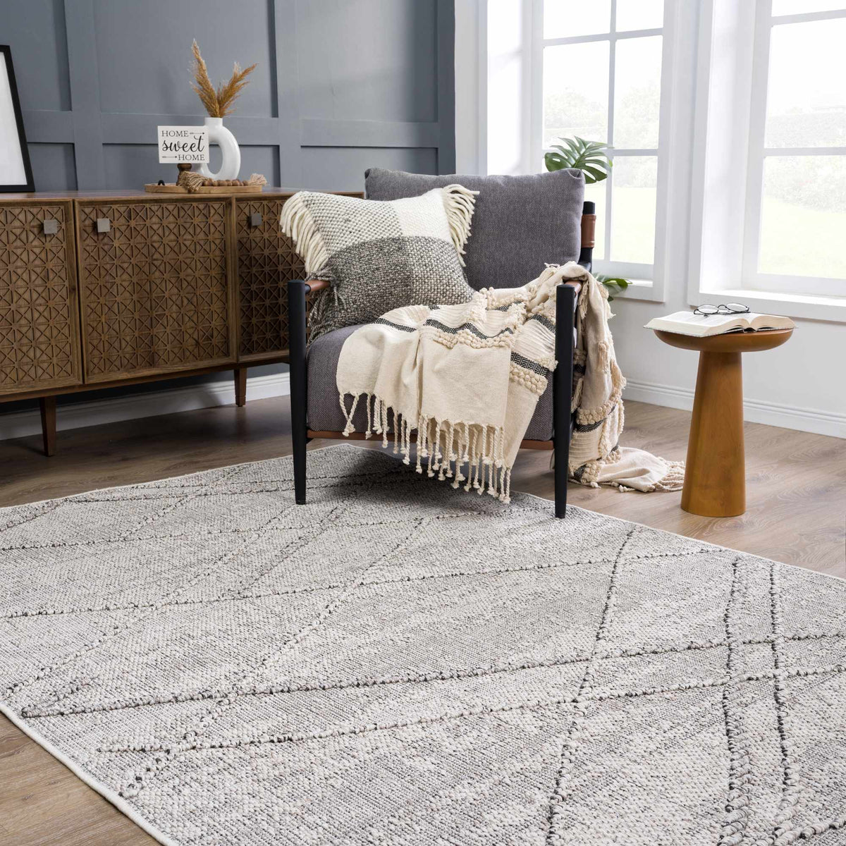 Baqer Bone & Taupe Area Rug, installed in a room