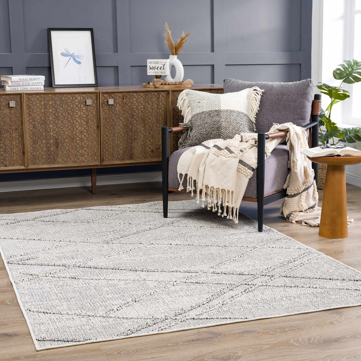 Baqer Bone & Taupe Area Rug, installed in a room