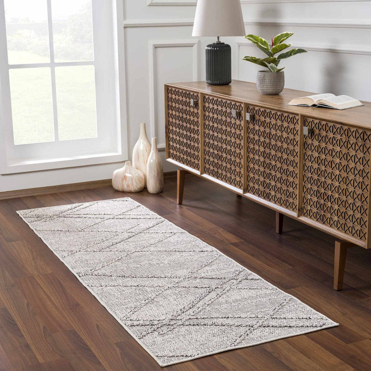 Baqer Bone & Taupe Area Rug, installed in a room
