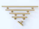 Lew's Round Bar Cabinet Knobs and Handles in Brushed Brass by Forge Hardware Studio