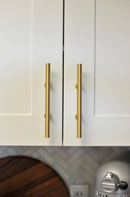 Lew's Round Bar Cabinet Knobs and Handles in Brushed Brass by Forge Hardware Studio