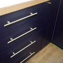 Lew's Round Bar Cabinet Knobs and Handles in Brushed Brass by Forge Hardware Studio