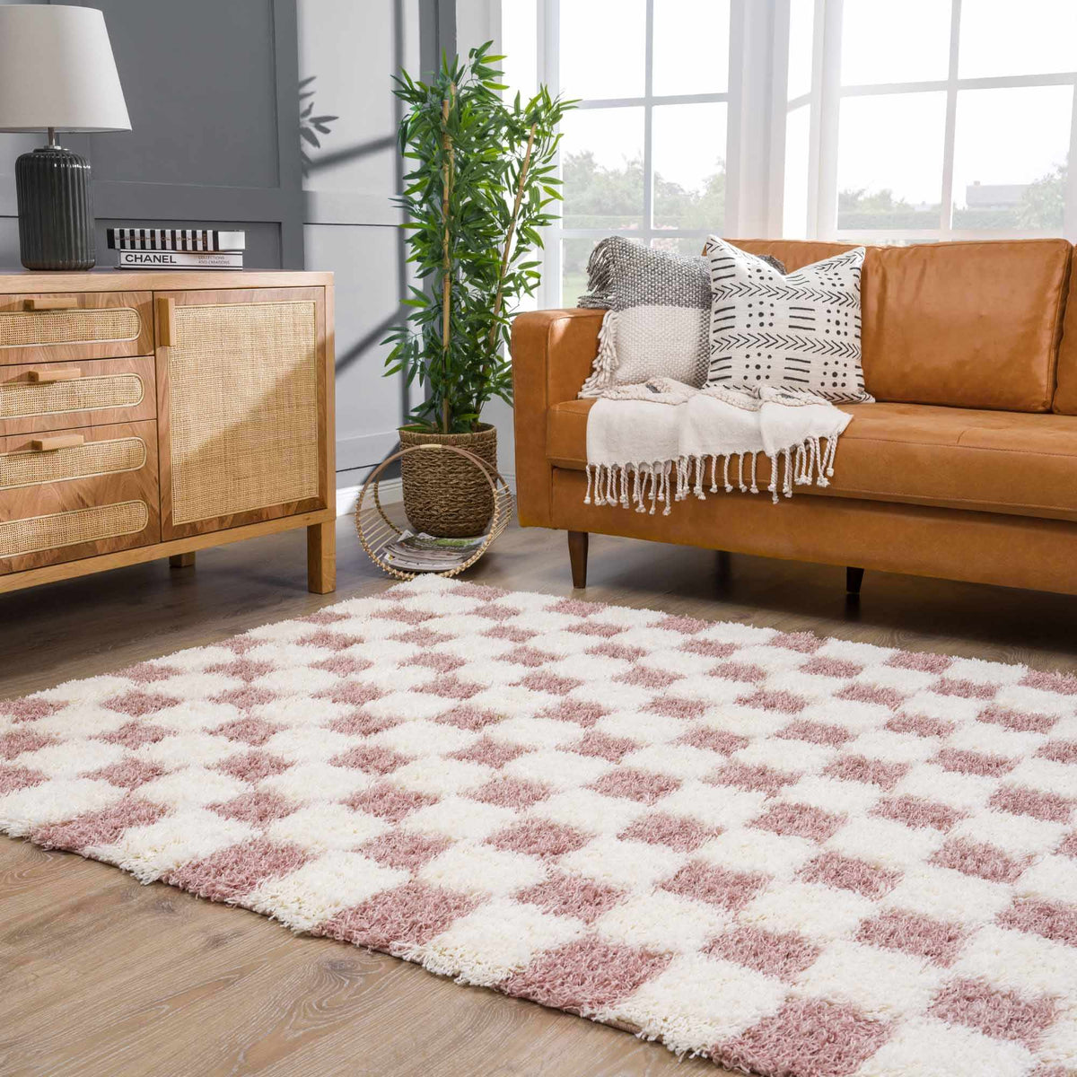 Atira Pink Checkered Area Rug, installed in a room