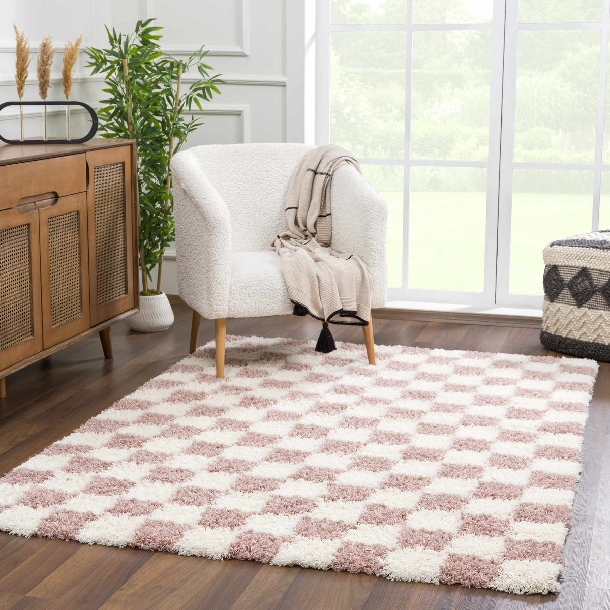Atira Pink Checkered Area Rug, installed in a room