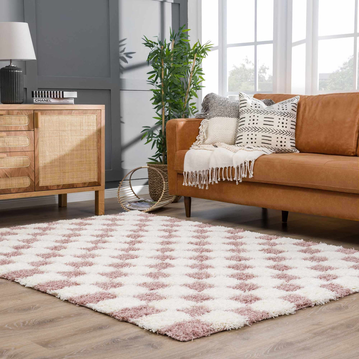Atira Pink Checkered Area Rug, installed in a room