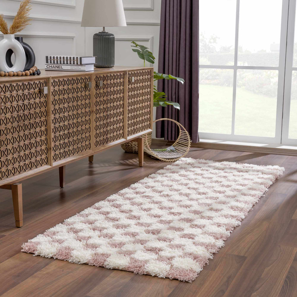 Atira Pink Checkered Area Rug, installed in a room