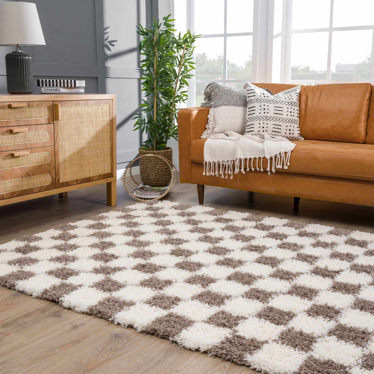Atira Brown Checkered Area Rug, installed in a room