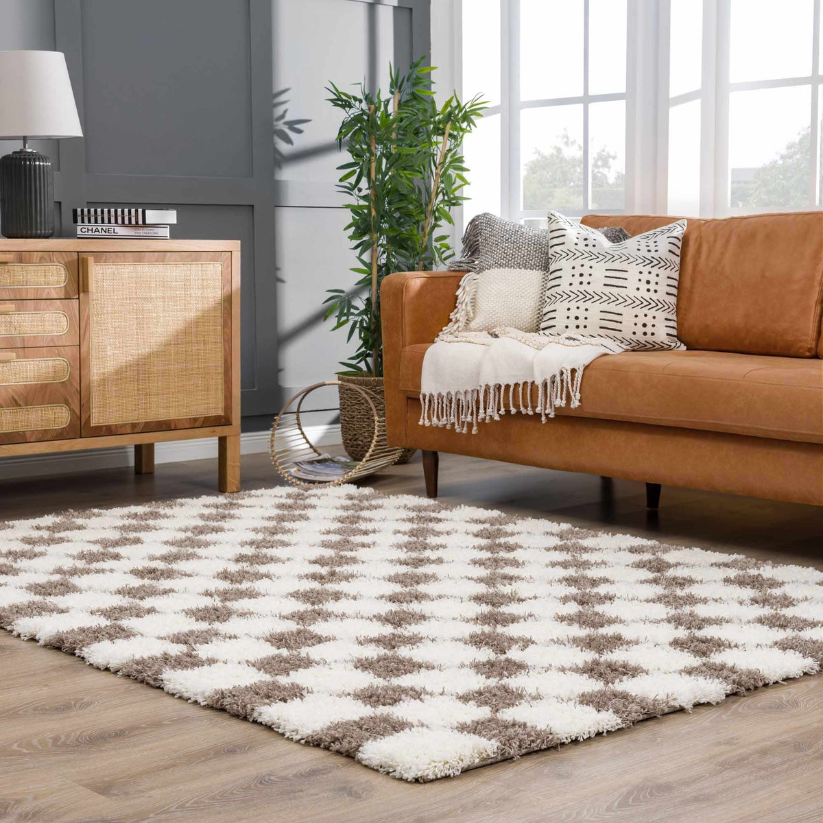 Atira Brown Checkered Area Rug, installed in a room
