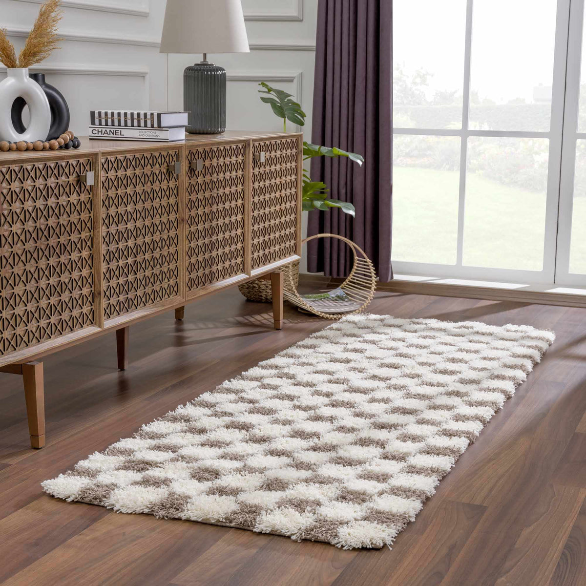 Atira Brown Checkered Area Rug, installed in a room