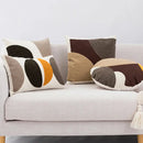 Abstract geometric earthy tone cushion cover living room decor by Decorbites