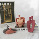 Abstract pink & beige ceramic art couple statue living room decor by Decorbites