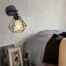 Adjustable industrial vintage black iron cage wall light bedroom by Decorbites