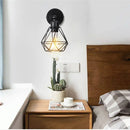 Adjustable industrial vintage black iron cage wall light bedroom by Decorbites