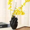 White anatomical heart vase with colorful flowers for living room by Decorbites