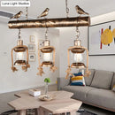 GobekUsa Antique Brass Lantern Pendant with Clear Glass and Bird Accent - 3-Light Coastal Island Kit