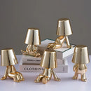 Articulated golden man table lamp for bedroom night light by Decorbites
