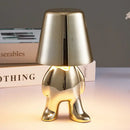 Articulated golden man table lamp for bedroom night light by Decorbites