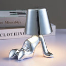 Articulated golden man table lamp for bedroom night light by Decorbites