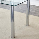 A modern minimalist style glass dining table. Transparent tempered glass tabletop with a thickness of 0.3 feet and silver metal legs. Suitable for restaurants and living rooms. 63 "x 35.4" x 30"