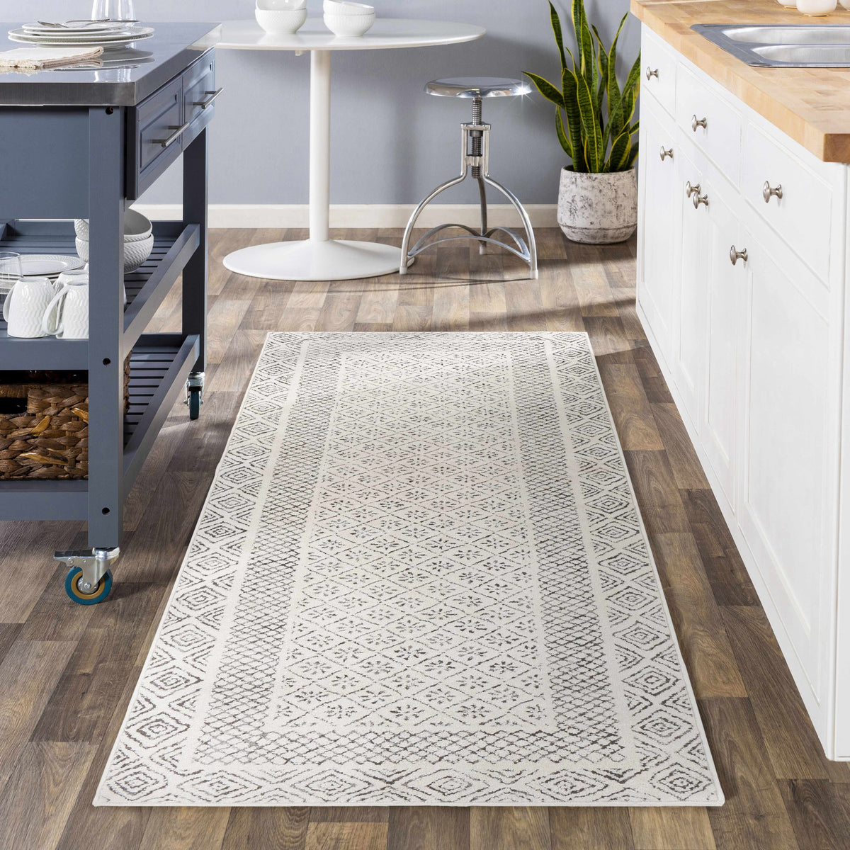 Burdette Soft Neutral Rug, installed in a room