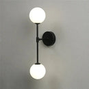 Black and gold glass wall lamp bedroom dual globe sconce by Decorbites