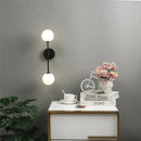 Black and gold glass wall lamp bedroom dual globe sconce by Decorbites