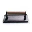 Black and light brown cast iron burger press kitchen meat tool by Decorbites