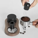 Black and stainless steel coffee distributor tamper set kitchen tool by Decorbites