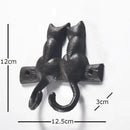 Black cast iron cat hook hanging shelf outdoor wall decor by Decorbites