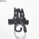 Black cast iron cat hook hanging shelf outdoor wall decor by Decorbites