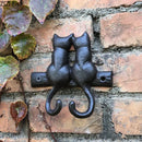 Black cast iron cat hook hanging shelf outdoor wall decor by Decorbites