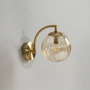 Blue and brass colored glass ball wall lamp for bedroom lighting by Decorbites