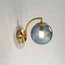 Blue and brass colored glass ball wall lamp for bedroom lighting by Decorbites