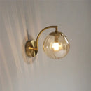 Blue and brass colored glass ball wall lamp for bedroom lighting by Decorbites