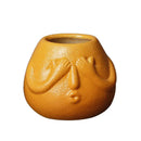 Blue and orange ceramic abstract human face planter living room decor by Decorbites