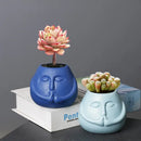 Blue and orange ceramic abstract human face planter living room decor by Decorbites